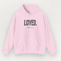 Pink hoodie with 'LOVED' text on a light gray background