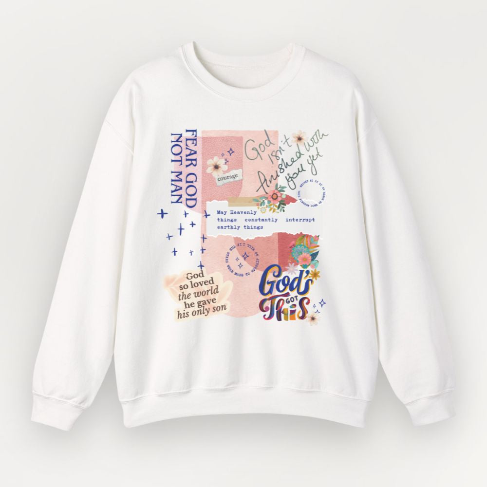 A white Everyday Faith crewneck sweatshirt featuring a colourful graphic collage on the front with religious quotes, floral illustrations, and pastel background blocks.