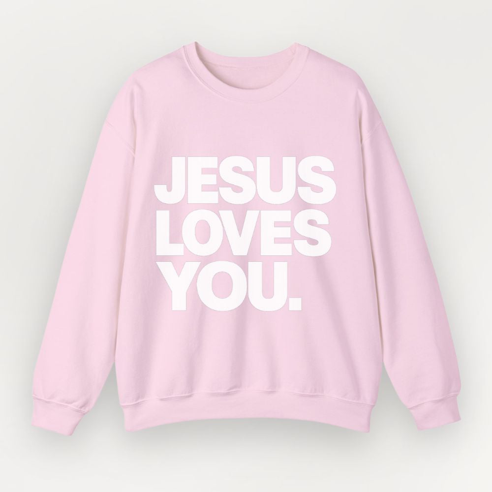 A light pink Everyday Faith crewneck sweatshirt with the phrase 'JESUS LOVES YOU.' printed in bold white capital letters across the chest, displayed against a light gray background.