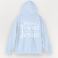 Light blue Everyday Faith essential hoodie with text 'What a Friend we have in Jesus' on a light gray background.