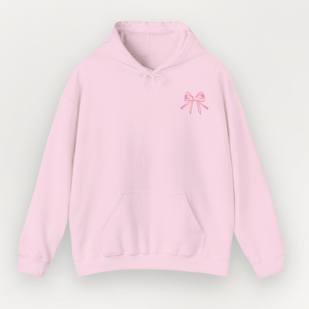 Pink hoodie with a bow design on a light gray background