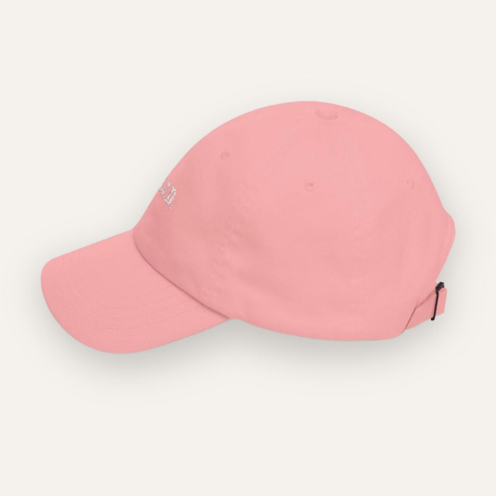 Pink baseball cap on a light gray background