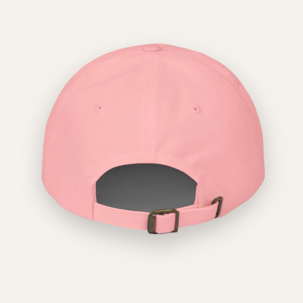 Pink baseball cap with a brown buckle on a light gray background