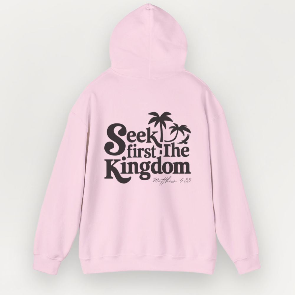 Pink hoodie with 'Seek first the Kingdom' text on a light gray background