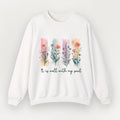 White sweatshirt with floral design and text 'It is well with my soul' on a light gray background